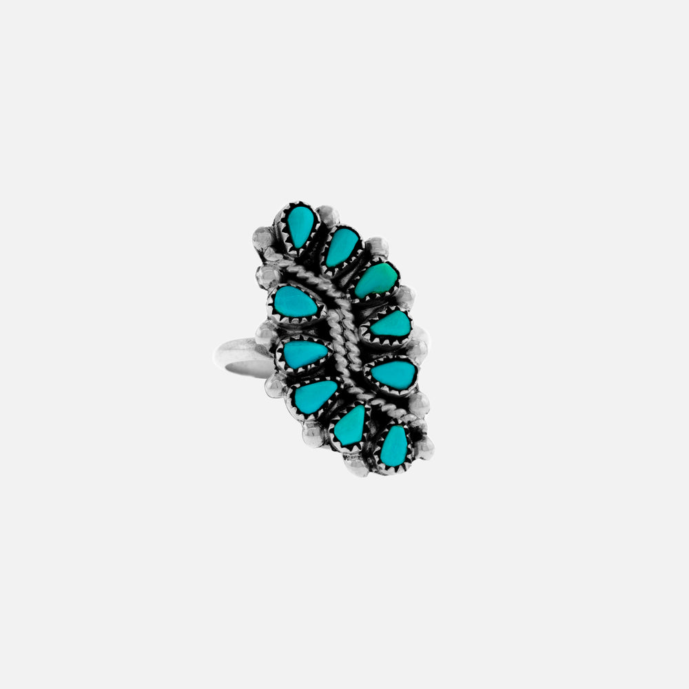A Native American Vine and Leaf Turquoise Ring with turquoise stones on a white background.