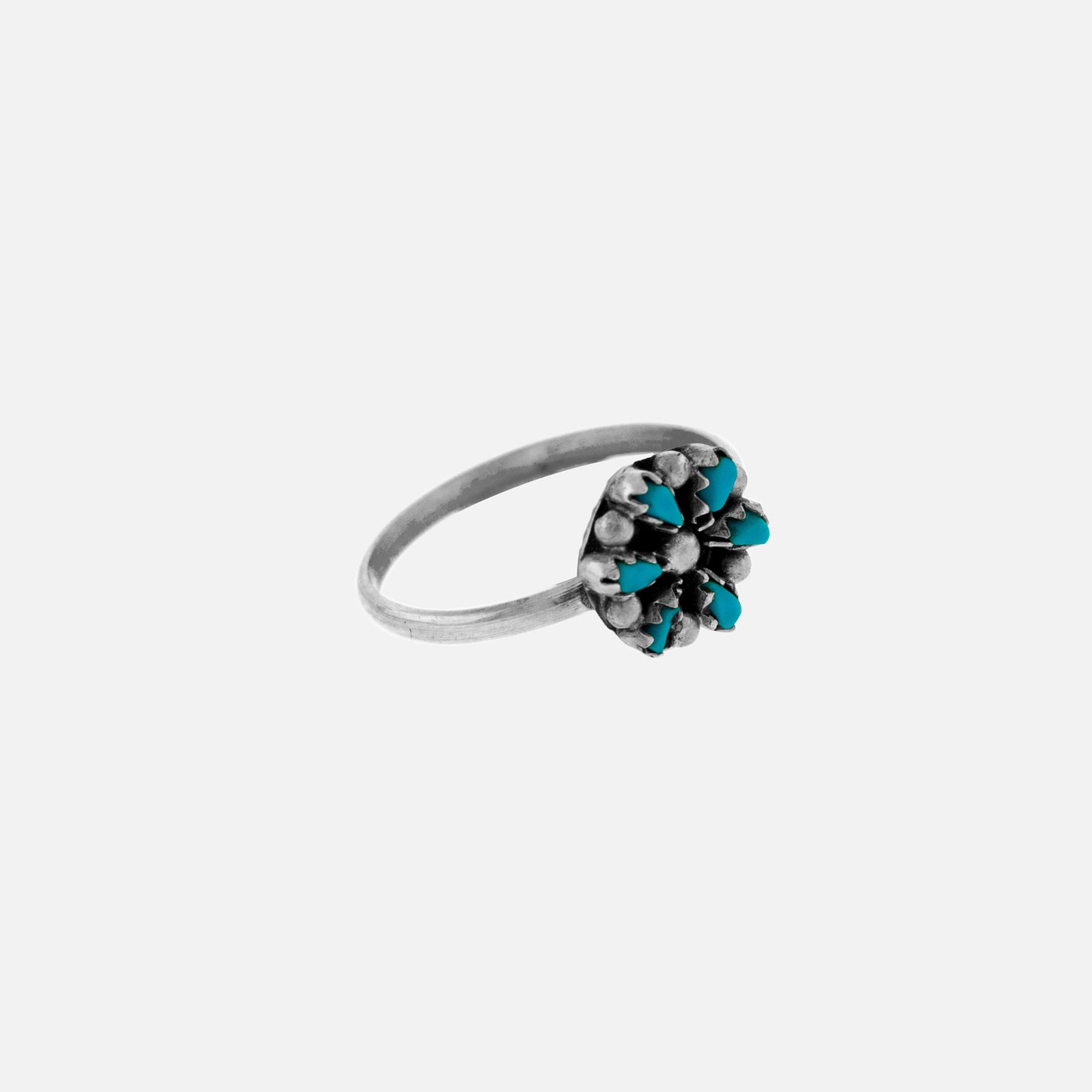 
                  
                    A Small Native American Turquoise Flower Ring with turquoise stones.
                  
                