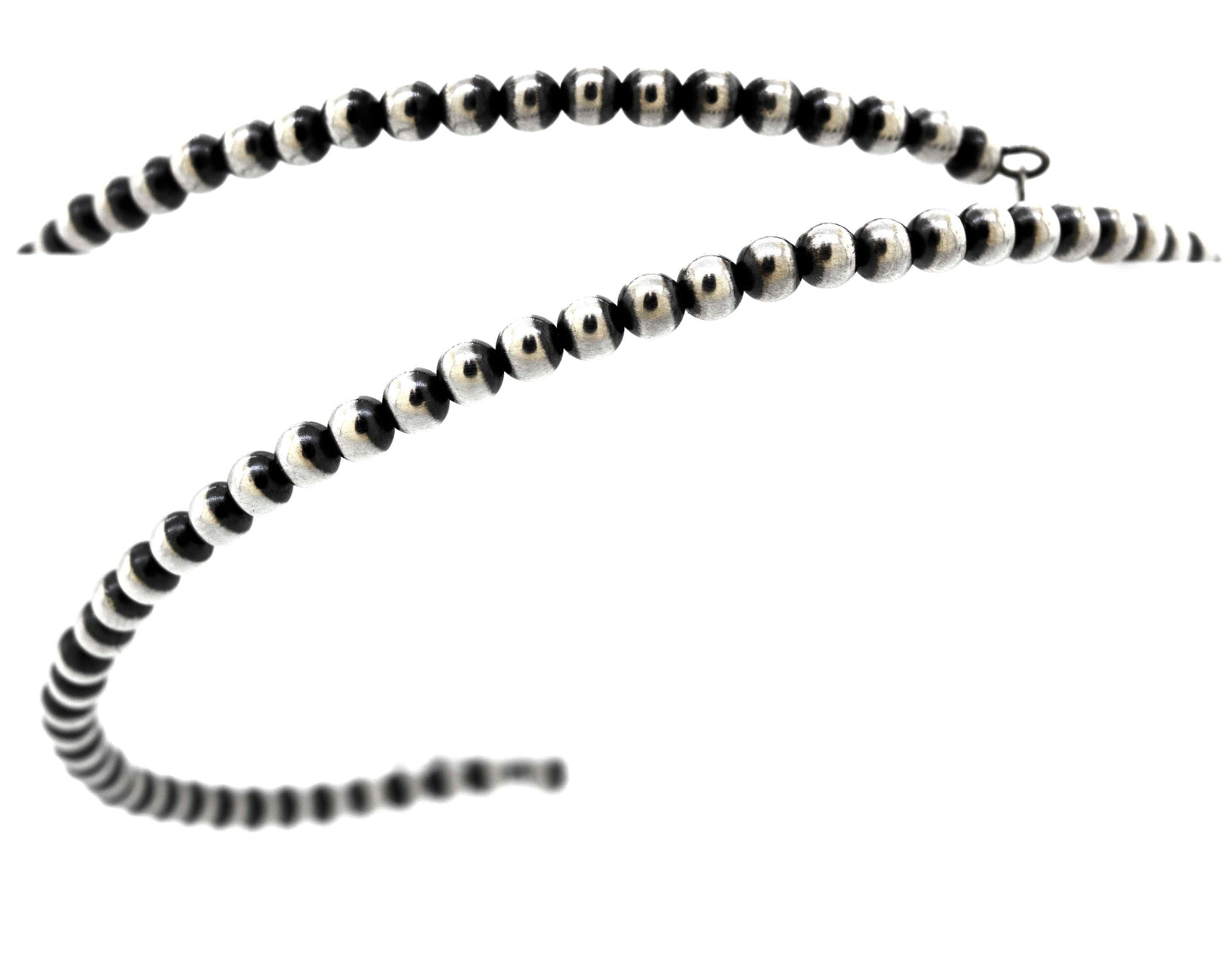 
                  
                    An edgy Super Silver Handcrafted Navajo Pearl Choker on a rustic white background.
                  
                