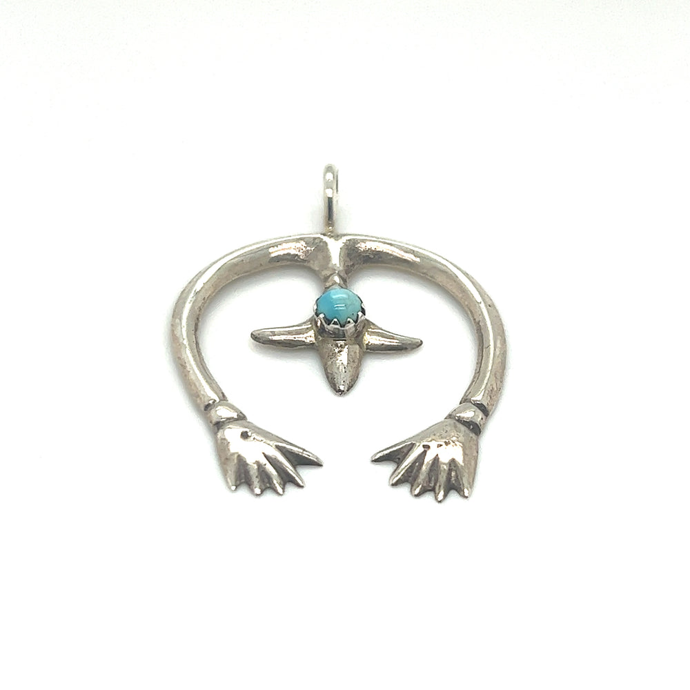 
                  
                    A southwest-inspired Super Silver Native American Naja Pendant With Turquoise.
                  
                