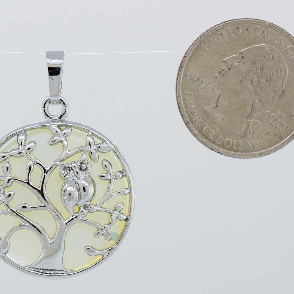 A Super Silver Owl and Tree Pendant.