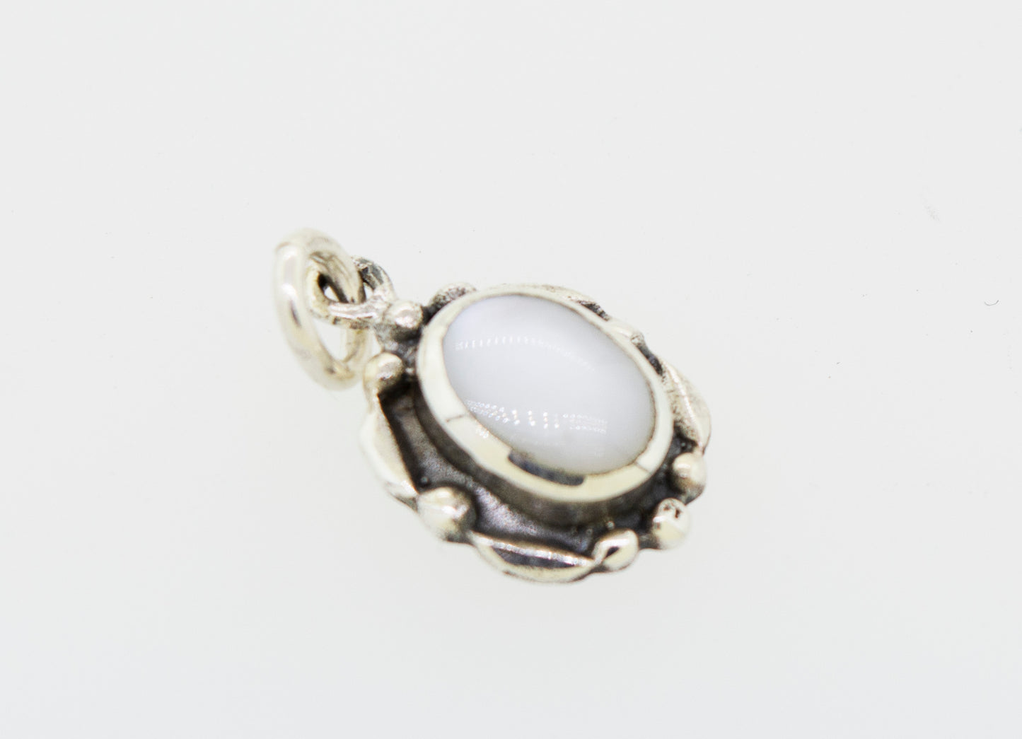 
                  
                    A Beautiful Oval Stone Pendant With Silver Border by Super Silver on a white background.
                  
                