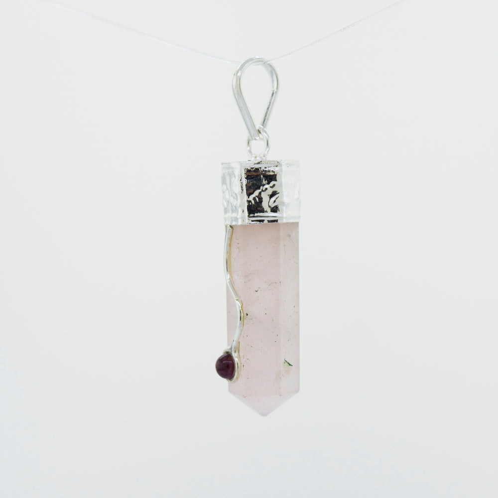 
                  
                    A Crystal Pendant with Decorative Bail hanging from a Super Silver chain.
                  
                