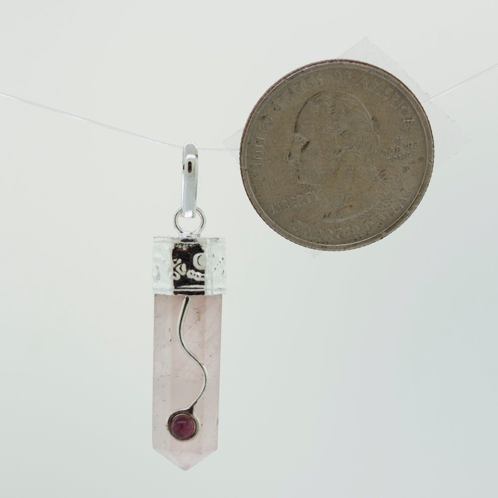 
                  
                    A Crystal Pendant with Decorative Bail by Super Silver, with a silver chain.
                  
                