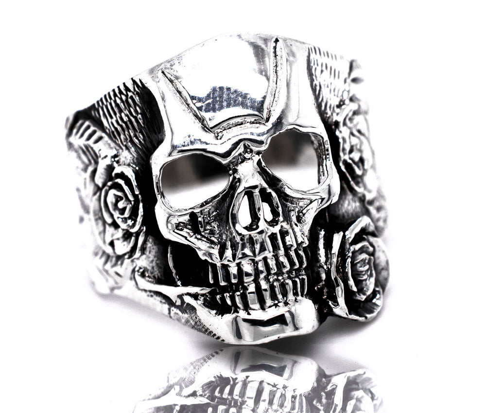 A sterling silver Skull Ring With Rose Design, combining cultural and edgy elements.