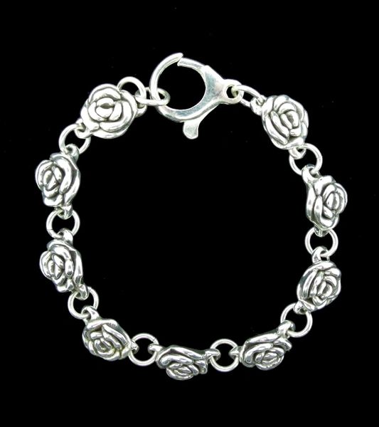 
                  
                    A Super Silver Chic Link Rose Bracelet with a vintage vibe on a black background.
                  
                