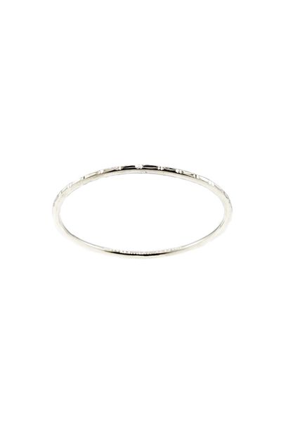 
                  
                    A Super Silver Rounded Faceted Bangle Bracelet with a small diamond on its faceted face.
                  
                