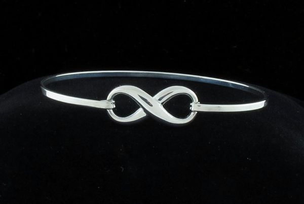 A Super Silver Dainty Infinity Sign Bracelet featuring an elegant infinity symbol and secured with a latch clasp.