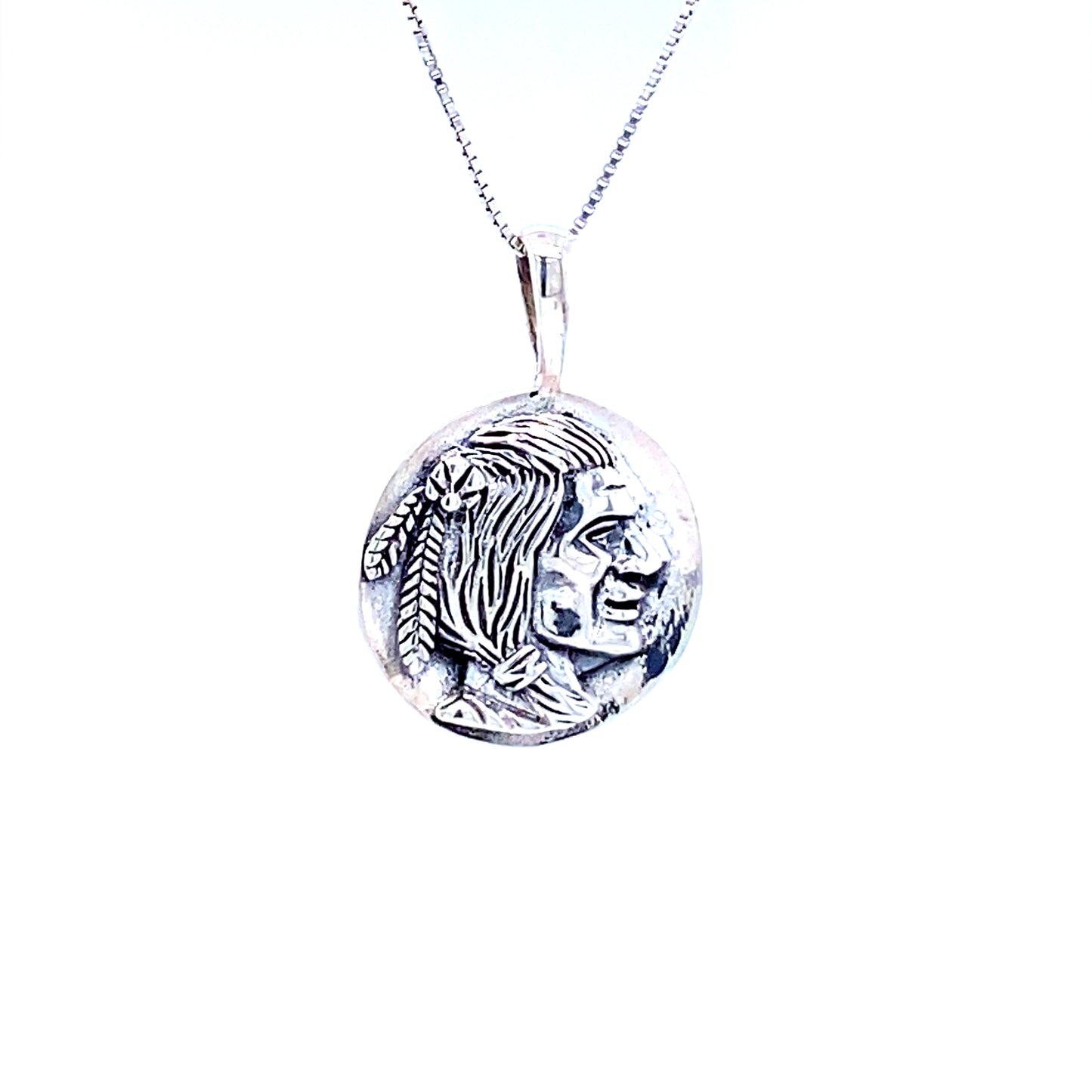 
                  
                    A Super Silver Native Head Coin Charm pendant.
                  
                