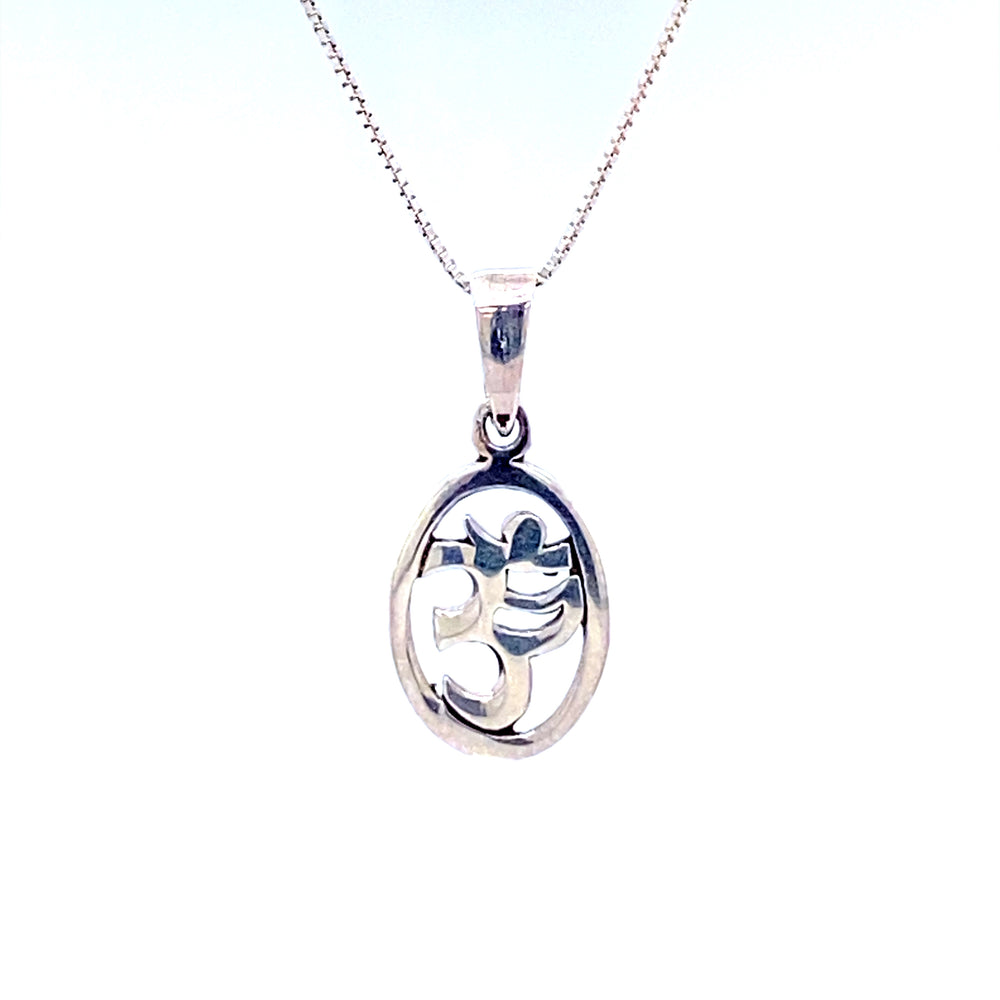 
                  
                    A Super Silver Oval Om Charm pendant with a flower on it.
                  
                