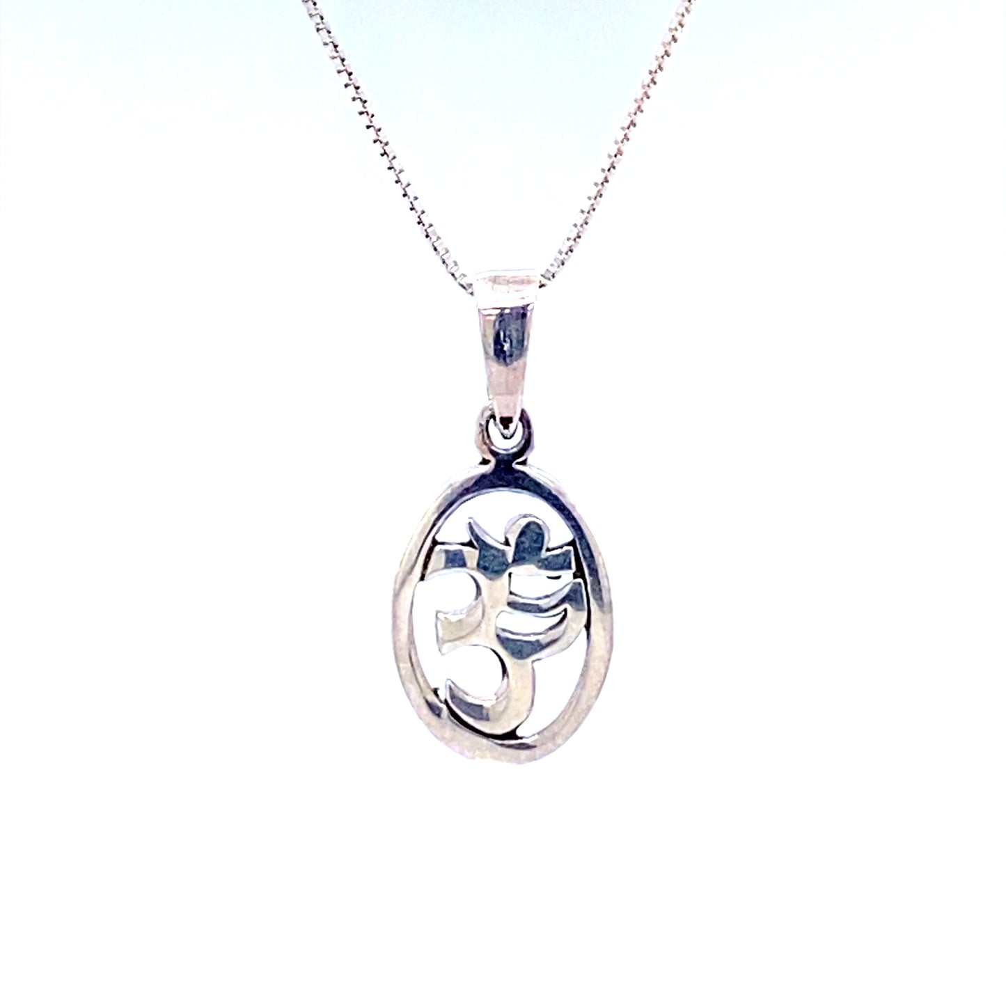 
                  
                    A Super Silver Oval Om Charm pendant with a flower on it.
                  
                