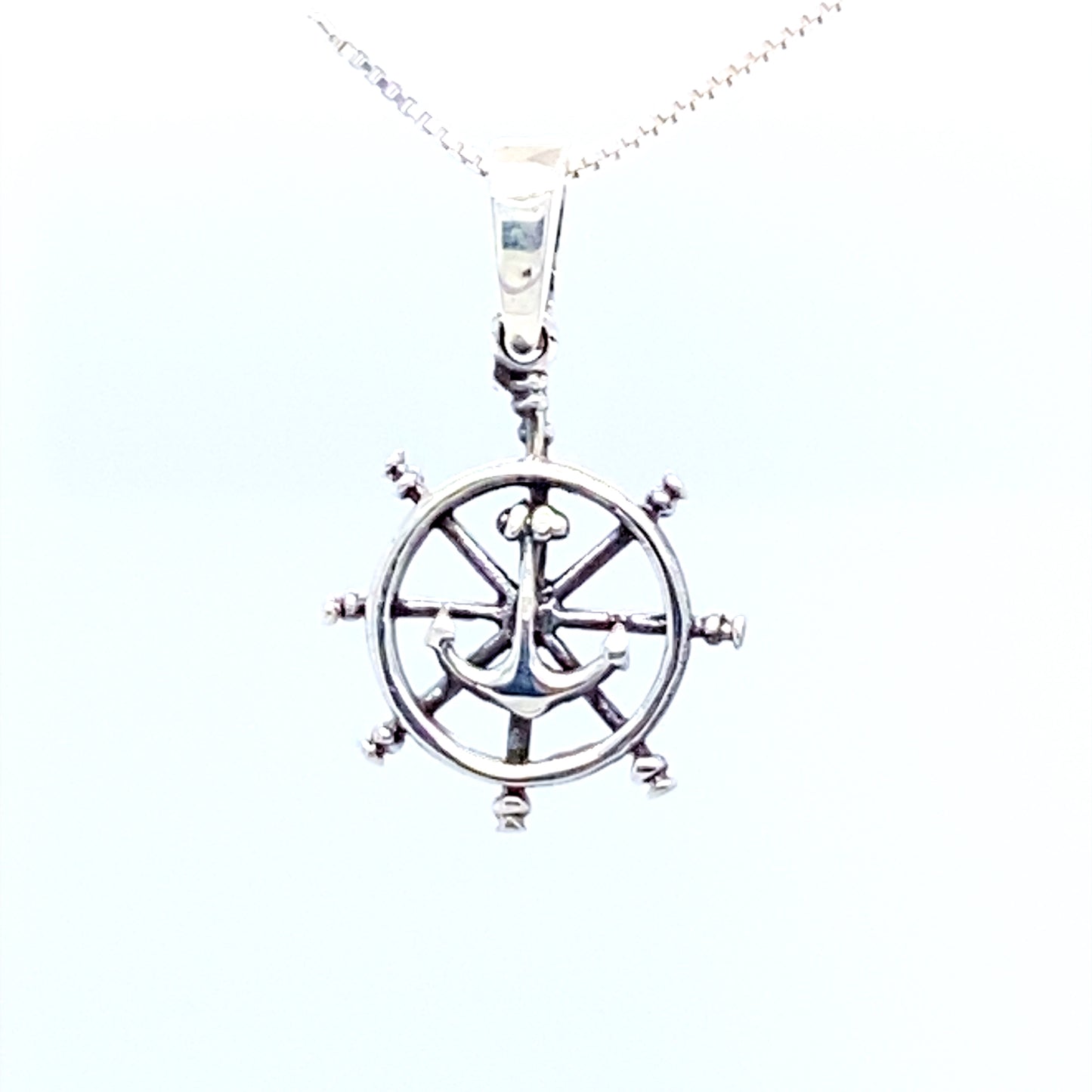 
                  
                    A Super Silver necklace featuring a Ships Wheel Charm with Anchor pendant, perfect for sea-fearing captains or those who love ocean-themed pendants.
                  
                