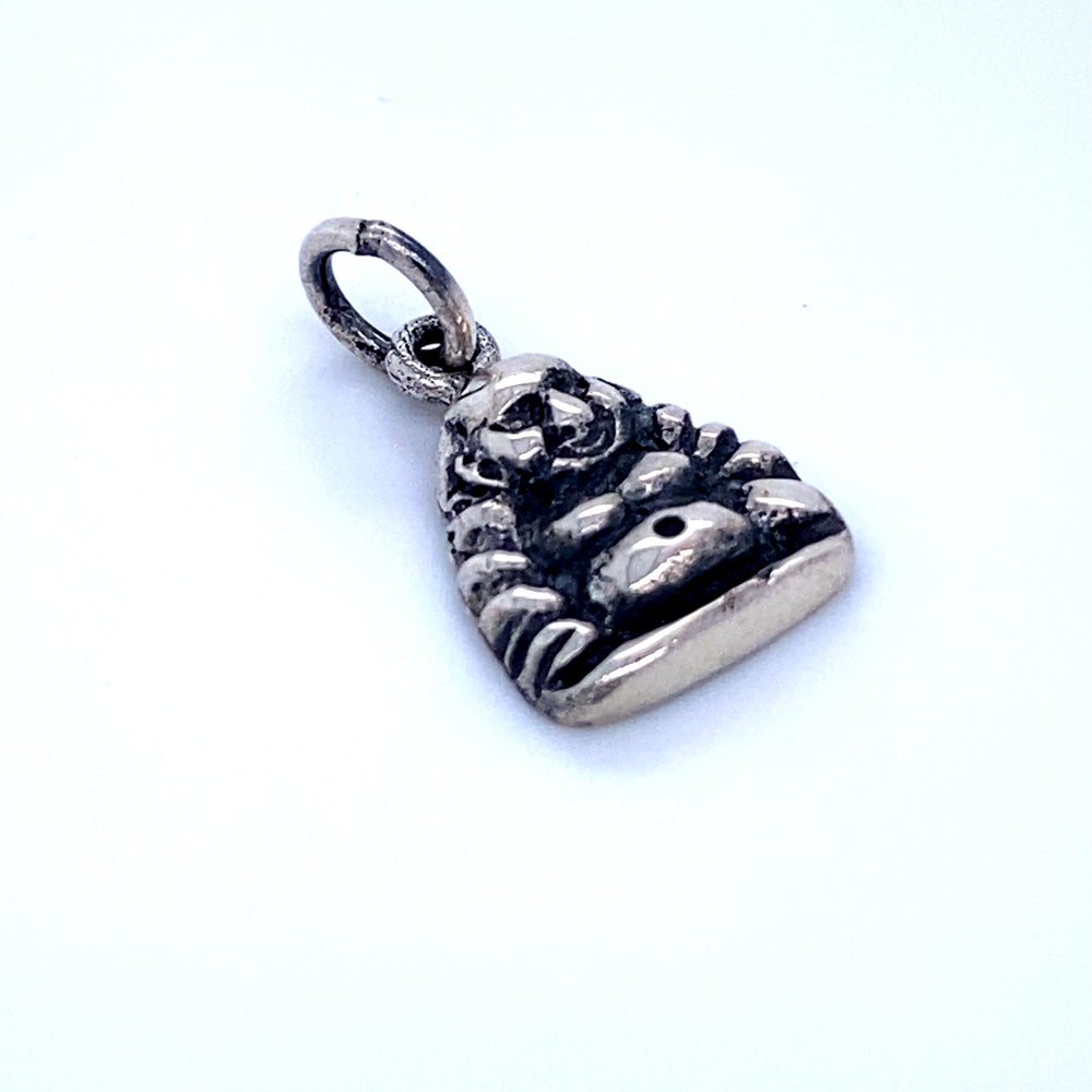 
                  
                    A Super Silver Laughing Buddha Charm pendant on a white surface.
                  
                