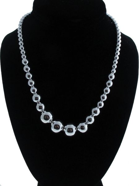 
                  
                    A Super Silver Graduated Silver Bead Necklace, also known as a statement necklace, on a mannequin.
                  
                