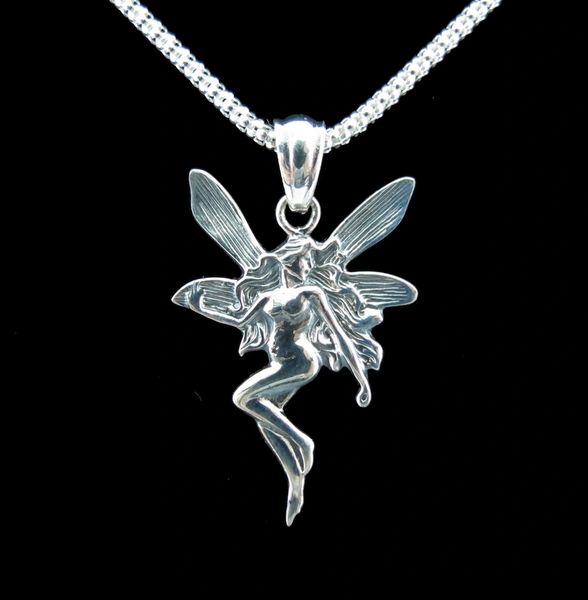 
                  
                    An enchanting Dancing Fairy Pendant by Super Silver on a black background.
                  
                