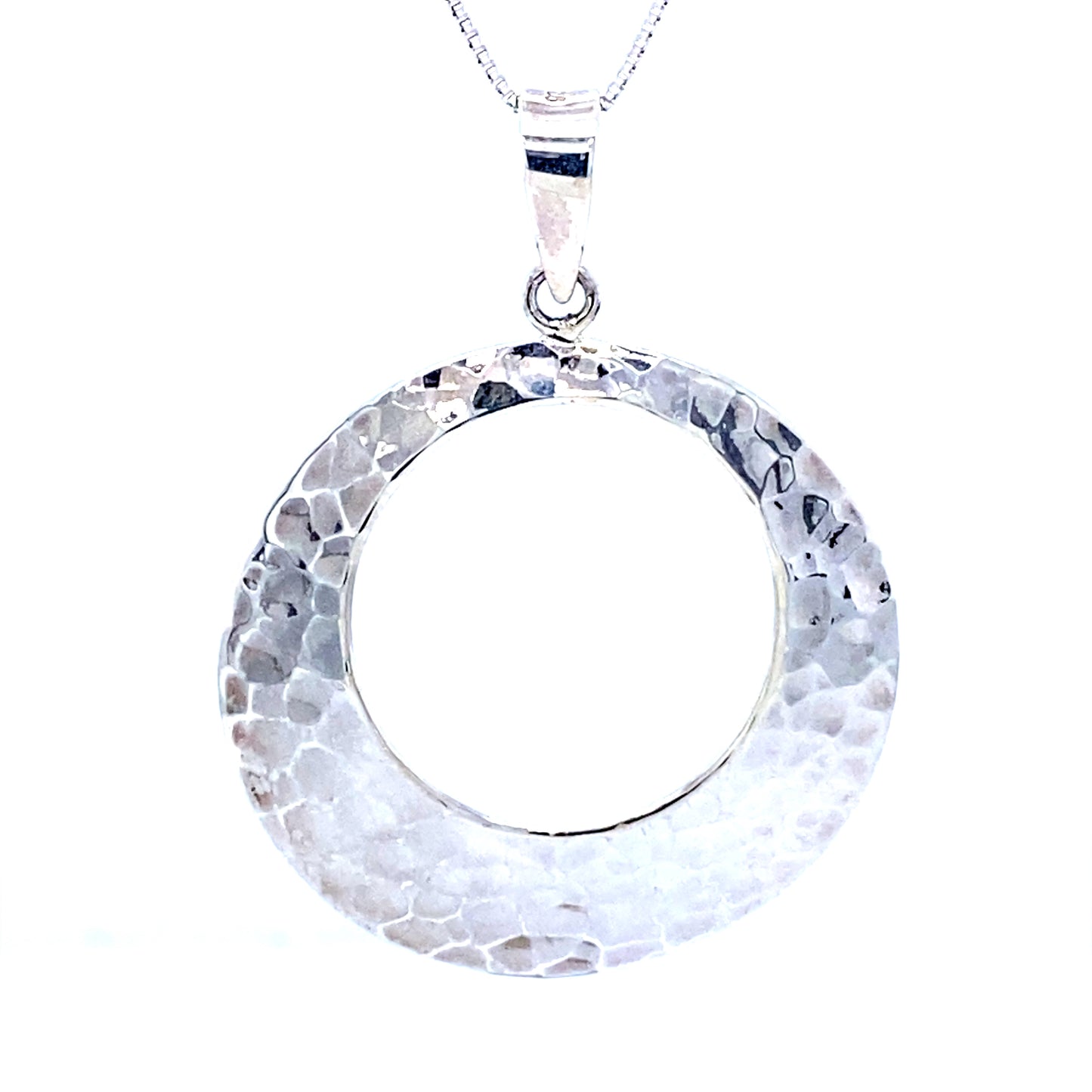 
                  
                    This sleek and modern Super Silver hammered round pendant is crafted in sterling silver.
                  
                