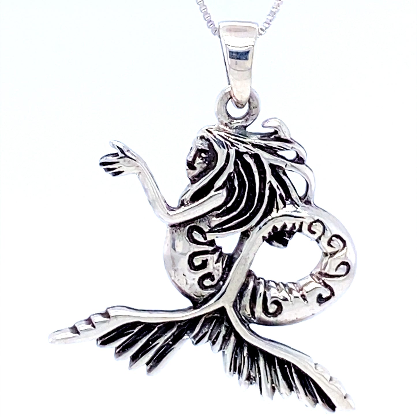 
                  
                    A seductive Super Silver Silver Siren Pendant on a chain, reminiscent of the ocean's waves.
                  
                
