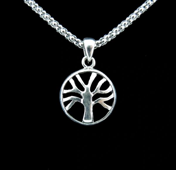 
                  
                    A Super Silver Small Round Tree of Life Pendant beautifully displayed on a black background.
                  
                