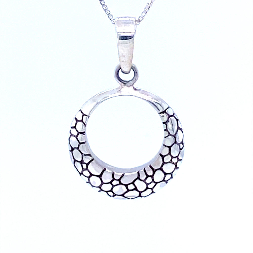 
                  
                    A modern take on a timeless design, this Super Silver Modern Round Cobblestone Pendant features black and white designs on a silver surface.
                  
                