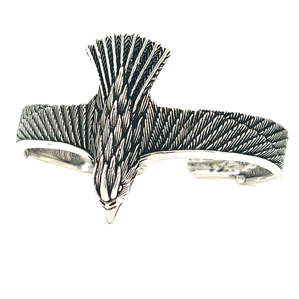 
                  
                    An oxidized Super Silver Unique Raven Cuff bracelet with an eagle on it, denoting symbolism.
                  
                