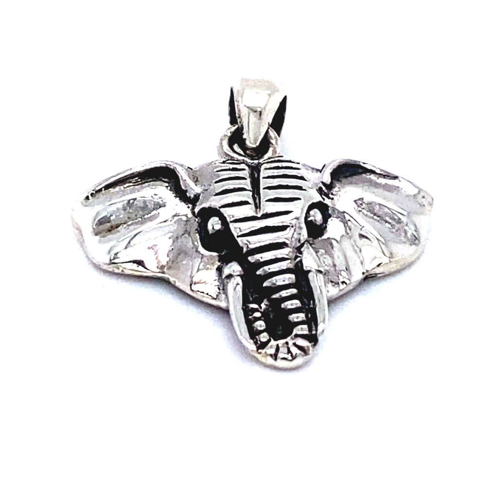 A dainty Super Silver Elephant Head Pendant on a white background.