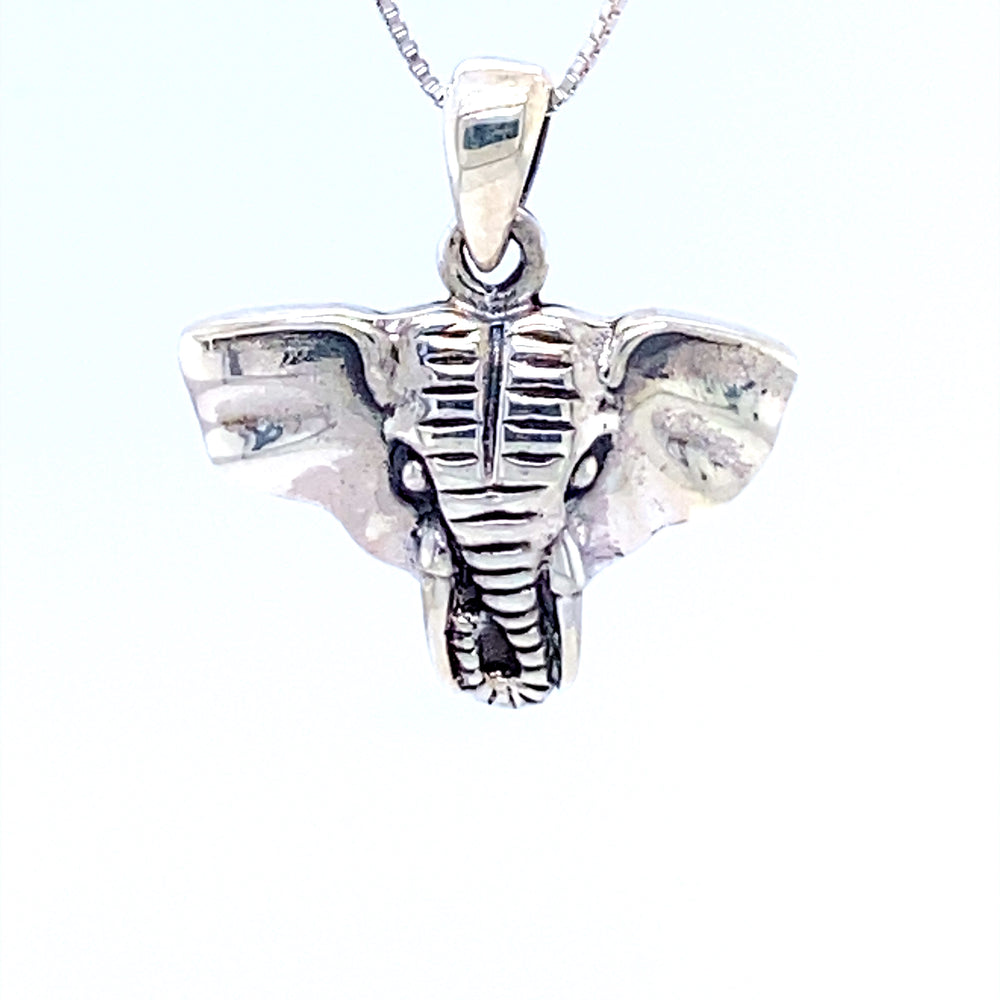 A Super Silver Elephant Head Pendant on a chain, perfect for boho-chic style.