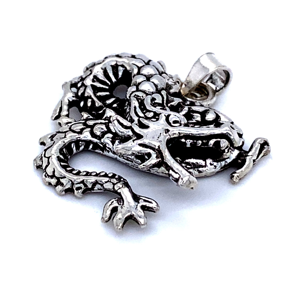A Dragon Pendant by Super Silver, with fine details, featuring a silver dragon on a white background.
