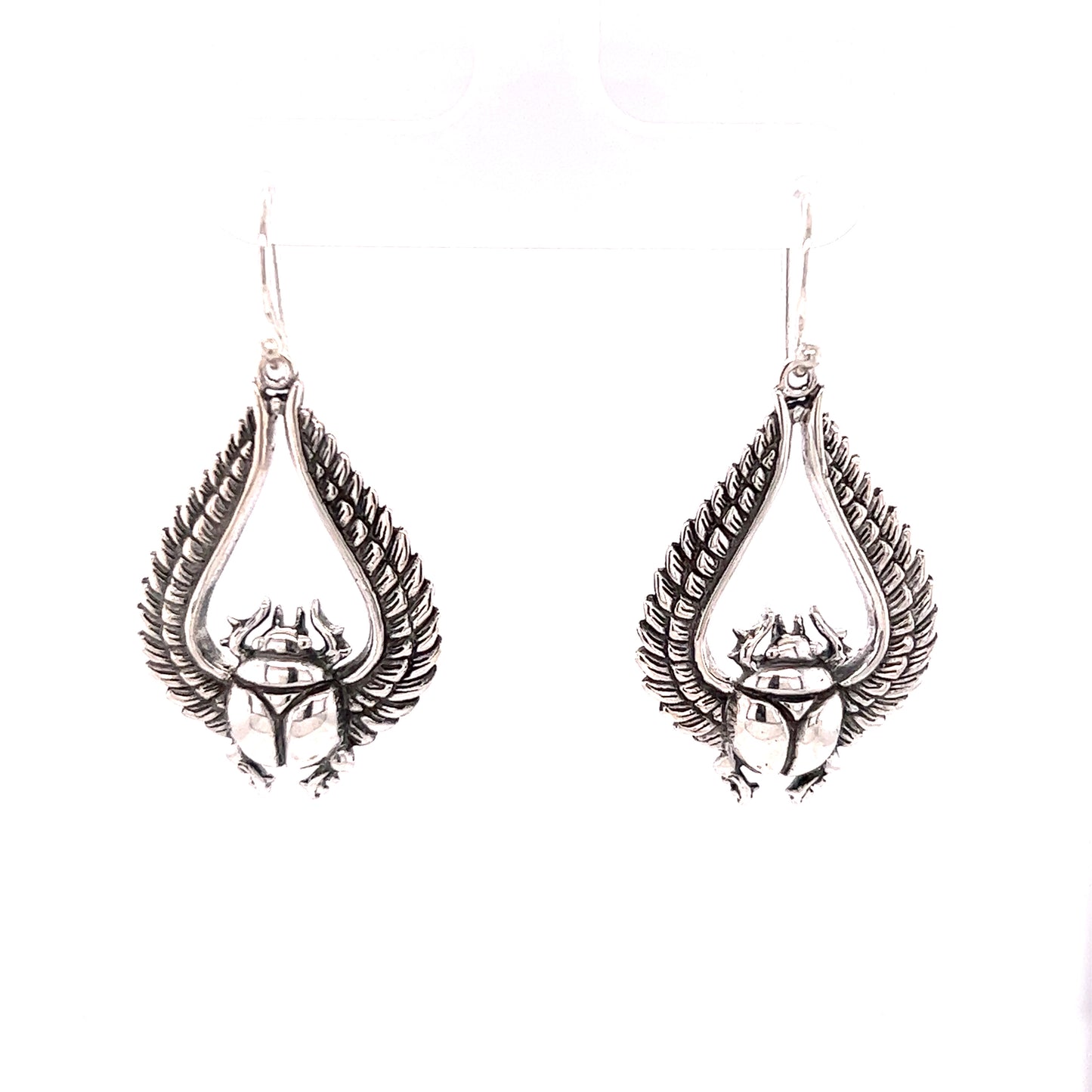 
                  
                    Super Silver's Winged Scarab Earrings featuring a winged scarab, providing protection.
                  
                