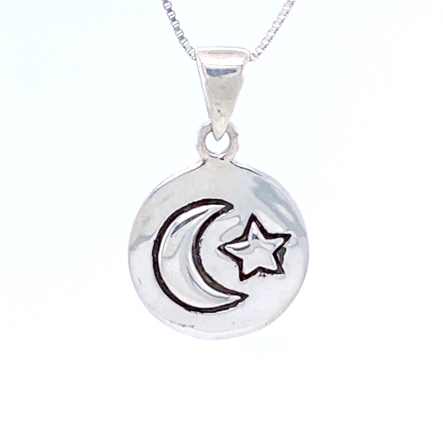 
                  
                    A Super Silver necklace with an oxidized finish and a Moon And Star Pendant featuring a crescent and star.
                  
                