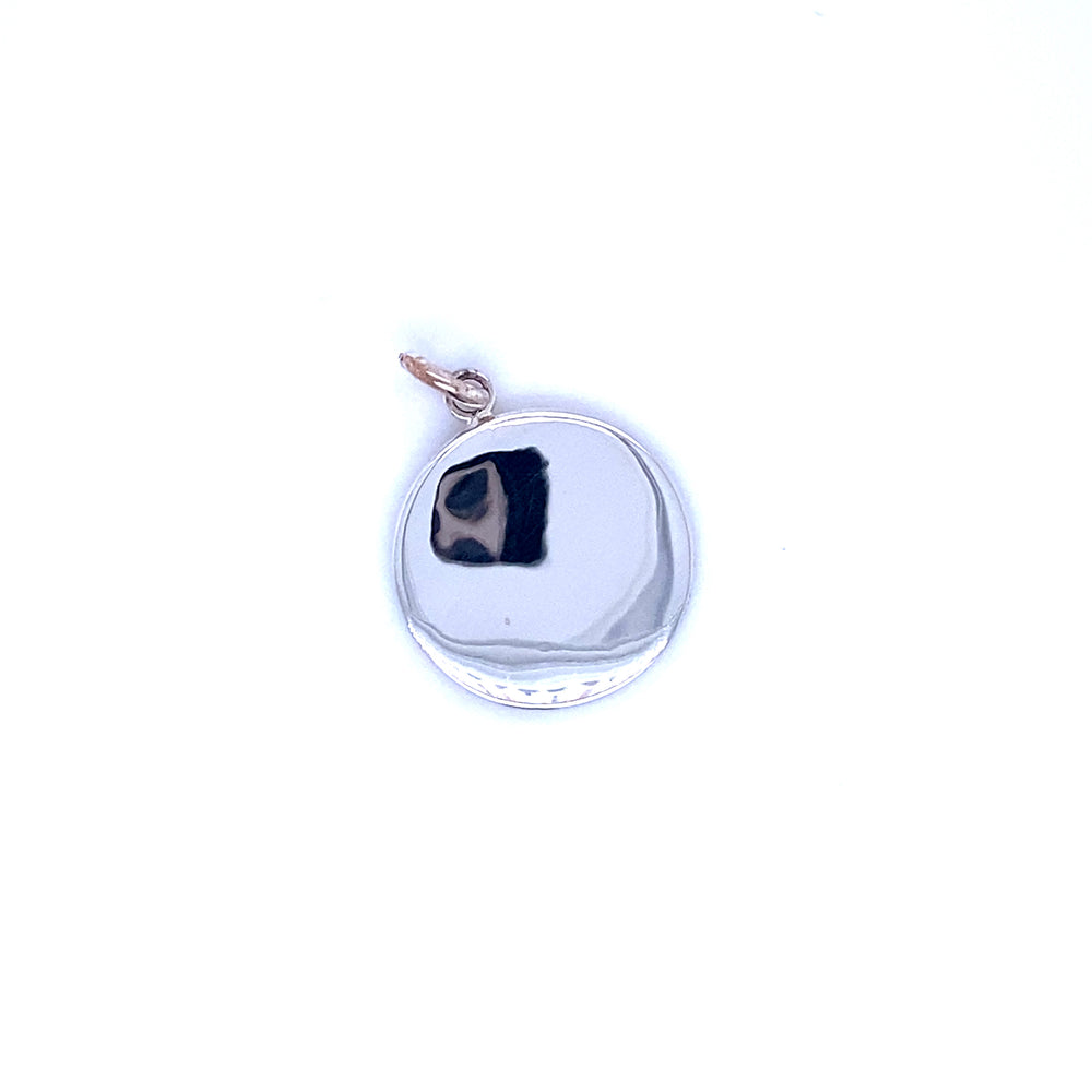 
                  
                    An Simple Round Engravable Pendant with a black circle on it by Super Silver.
                  
                