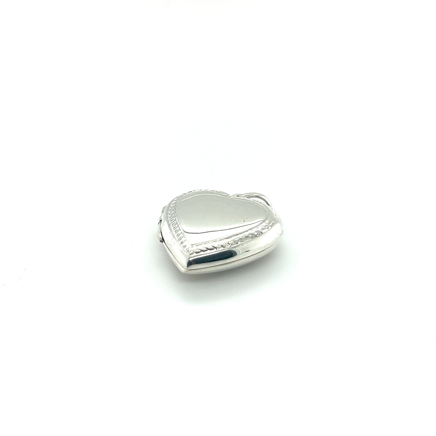 
                  
                    A Super Silver Heart Locket with Delicate Rope Border on a white background.
                  
                
