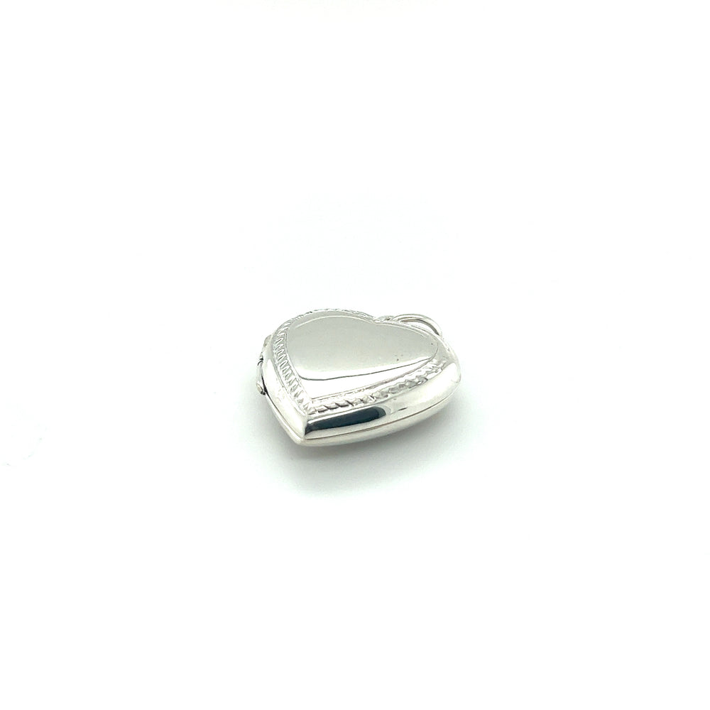 A Super Silver Heart Locket with Delicate Rope Border on a white background.