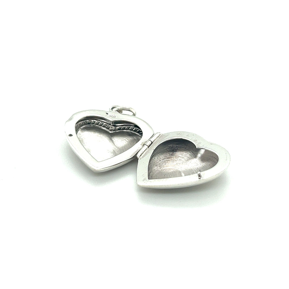 
                  
                    Two Super Silver Heart Lockets with Delicate Rope Border on a white background.
                  
                