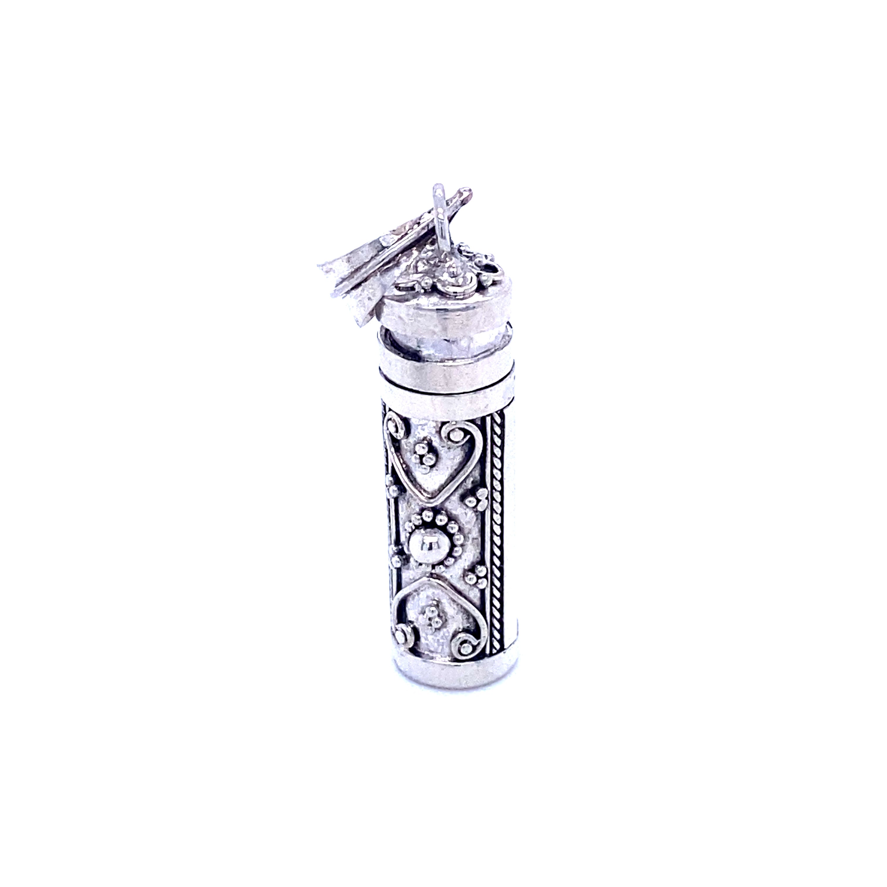 A Super Silver Prayer Box Pendant adorned with an ornate design, ideal for storing religious scripture or serving as a cherished memento.