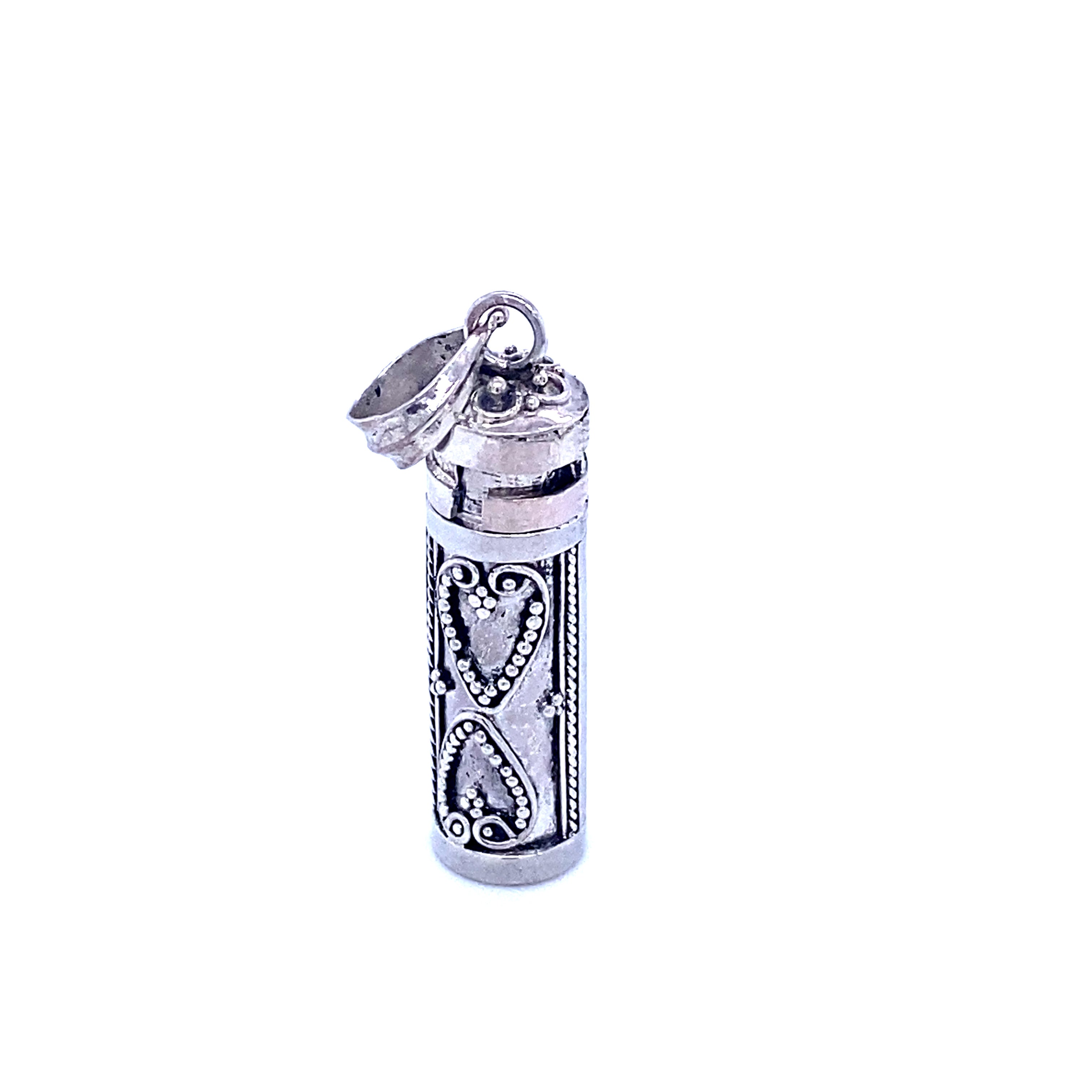 An ornate Super Silver bottle, resembling religious scripture mementos or Prayer Box Pendants.
