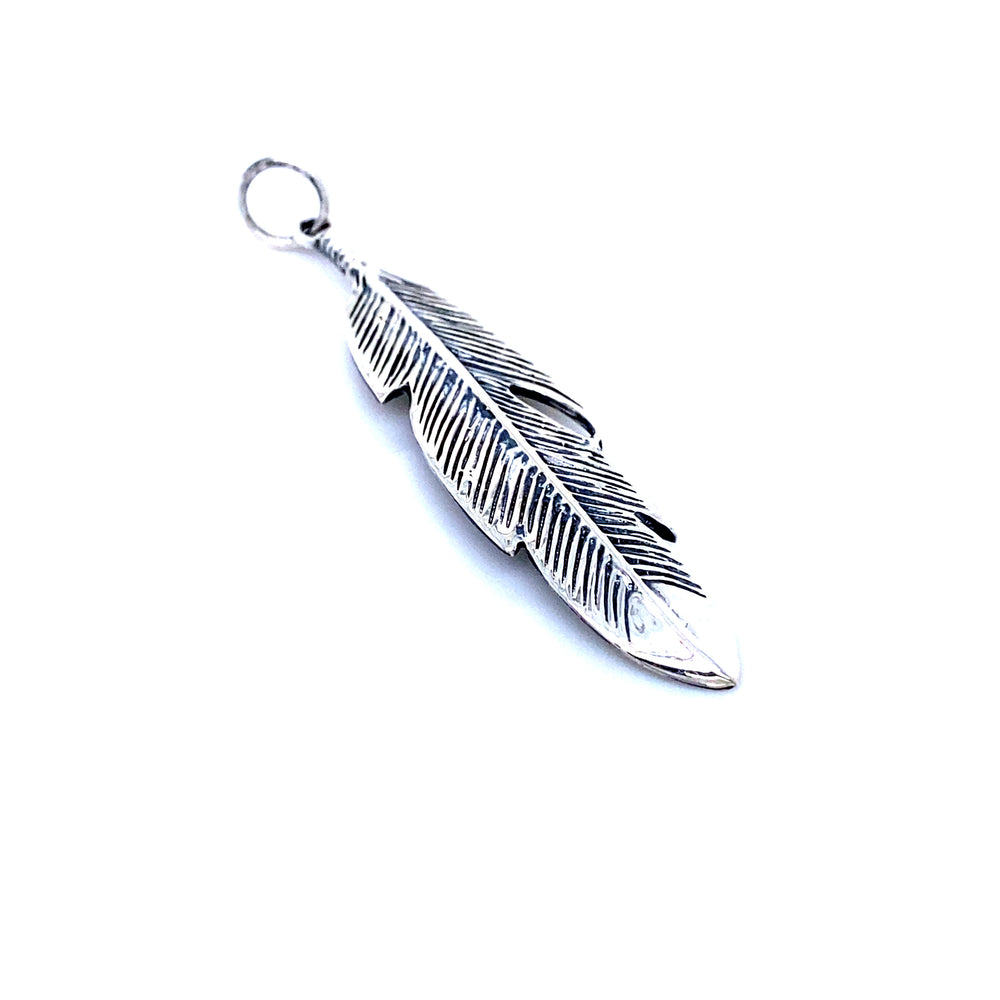 A Small Feather Pendant from Super Silver, symbolizing individuality and an untamed spirit, against a white backdrop.