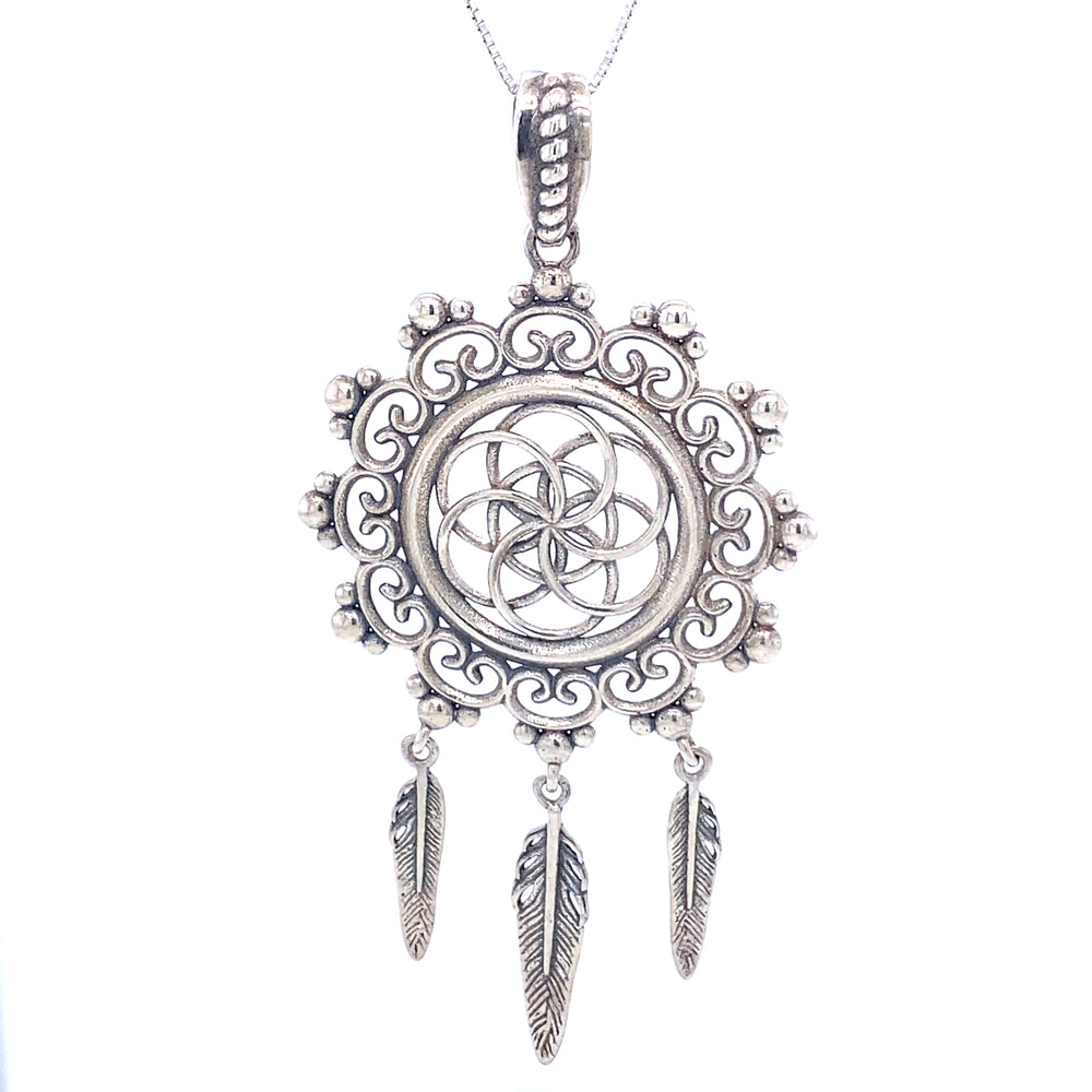 
                  
                    A long Flower of Life Mandala pendant with feathers made of .925 Sterling Silver by Super Silver.
                  
                