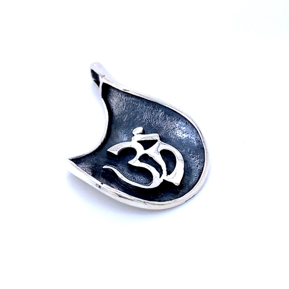 
                  
                    A Super Silver Om Symbol Pendant with an oxidized finish, featuring an Om symbol.
                  
                