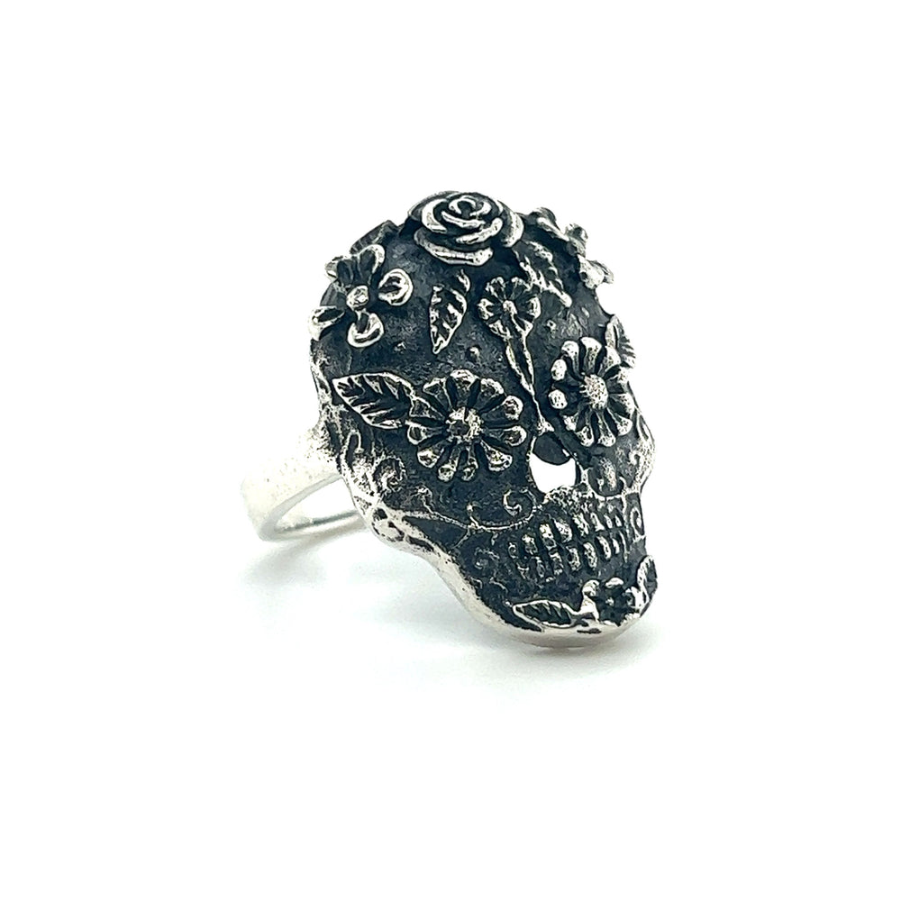 
                  
                    An intricate sugar skull ring on a white background.
                  
                