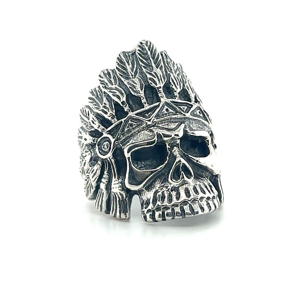 
                  
                    A native-inspired Chief Skull ring with stone inlay and feathers.
                  
                