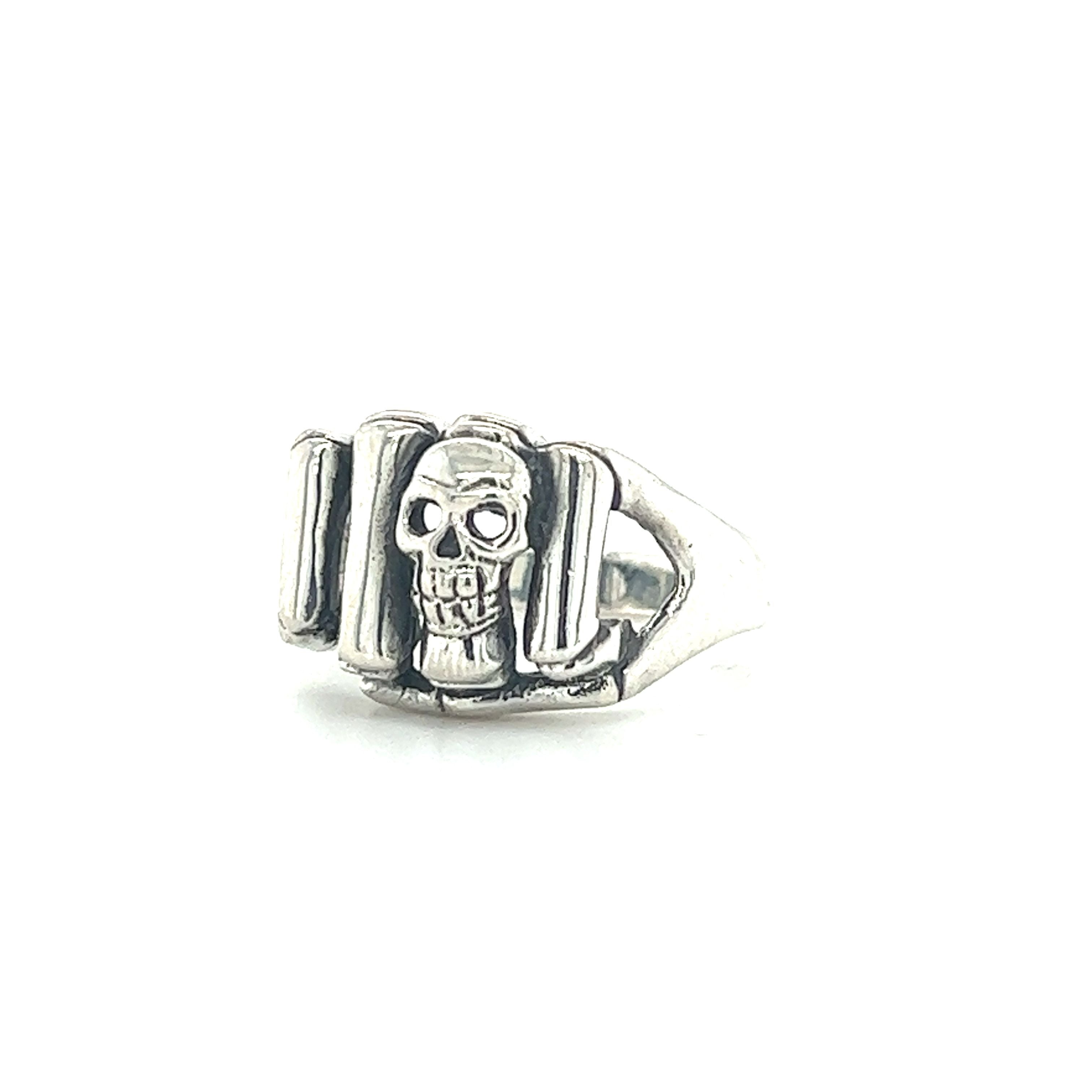 A sterling silver Skeleton Fist Ring With Small Skull for men.