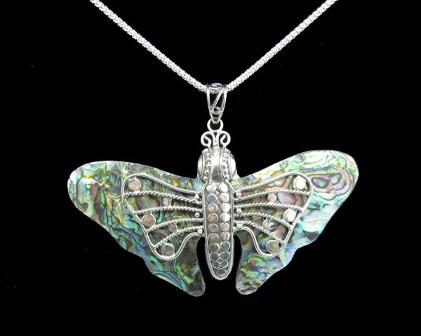 
                  
                    A Large Abalone Butterfly Pendant from Super Silver on a black background.
                  
                