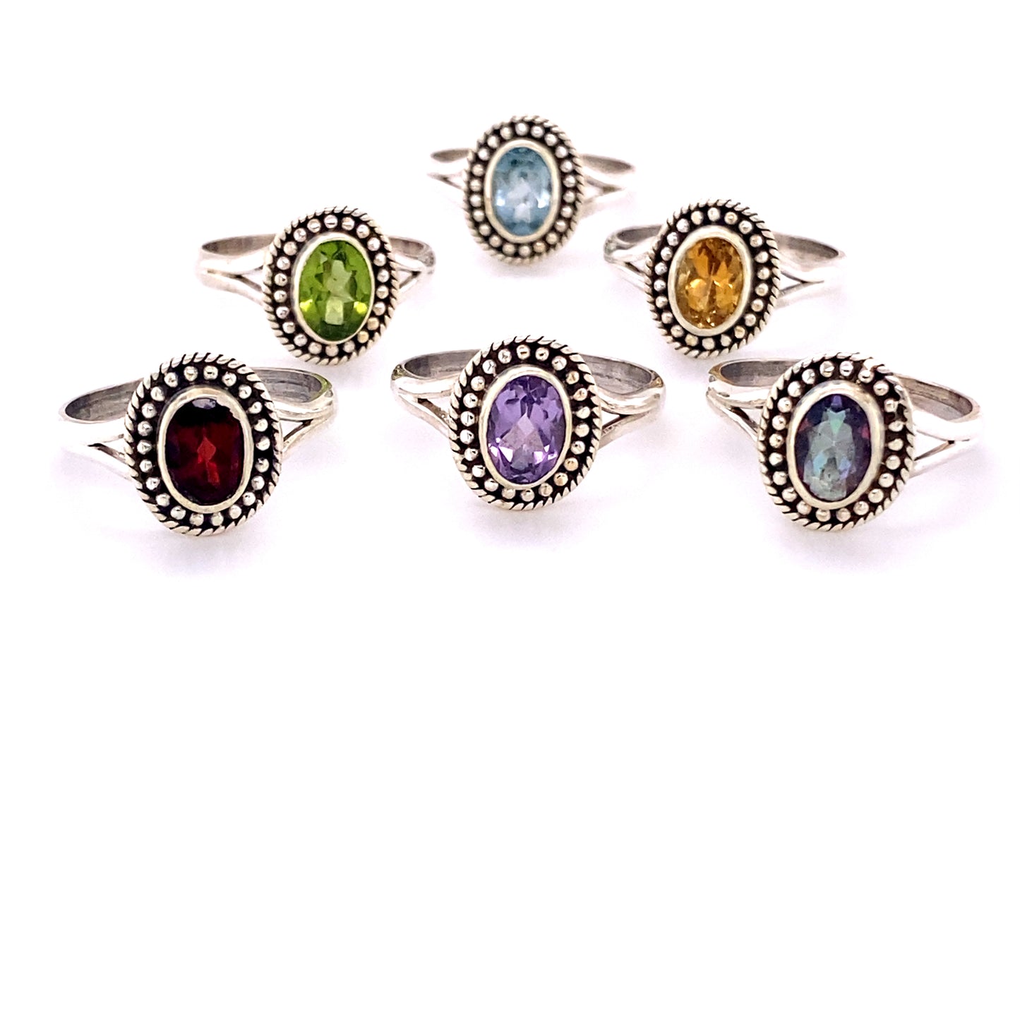 A set of Oval Gemstone Rings with Ball Disk Rope Border.
