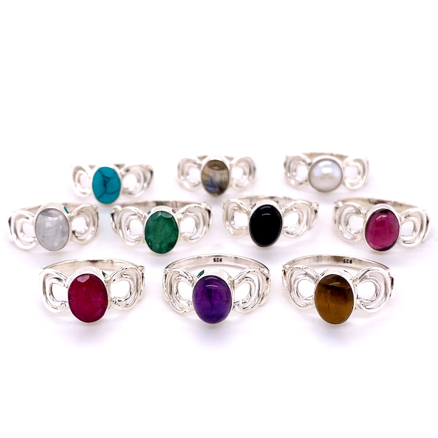 A set of Oval Gemstone Rings with Moon Design adorned with vibrant cabochon stones.