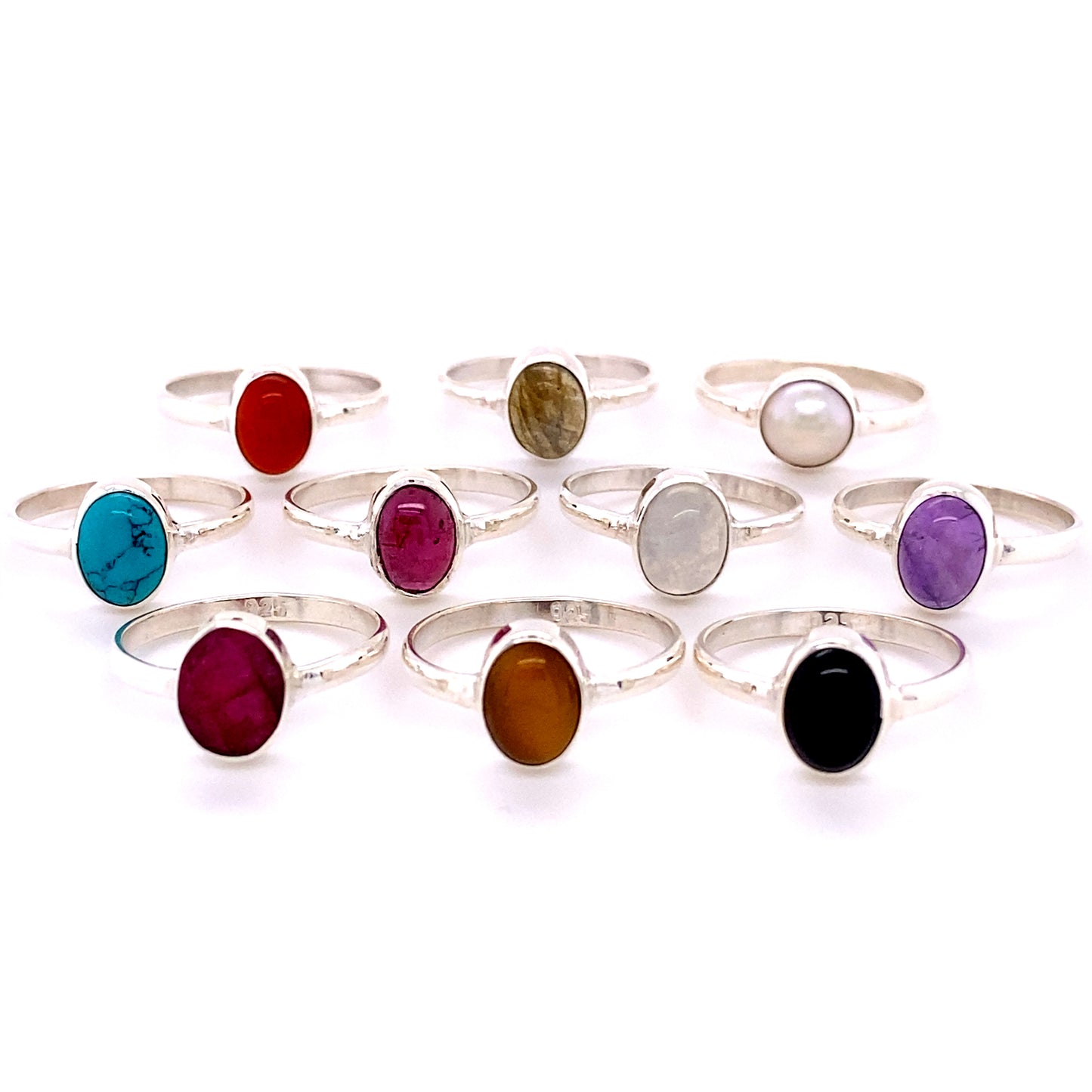 A set of Simple Oval Natural Gemstone Rings with different colored stones.