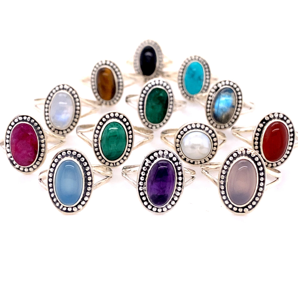 A collection of Super Silver Trendy Oval Rings made with .925 Sterling Silver, featuring various stones in different colors.