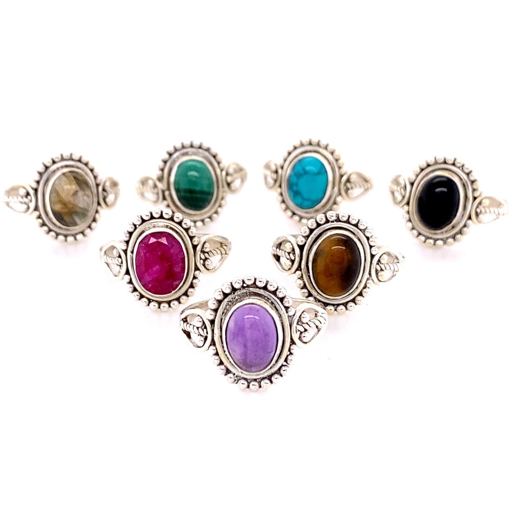 A group of Oval Gemstone with Ball Design rings on a white background.