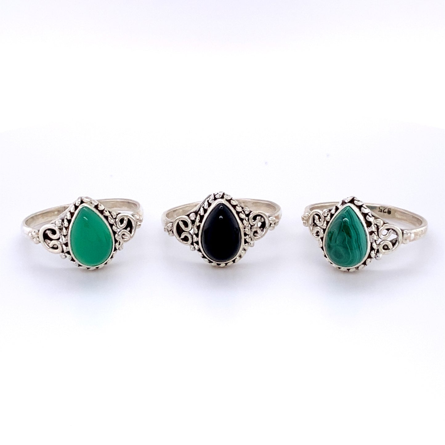 Three Teardrop Gemstone Rings with Intricate Ball Border in a boho style.