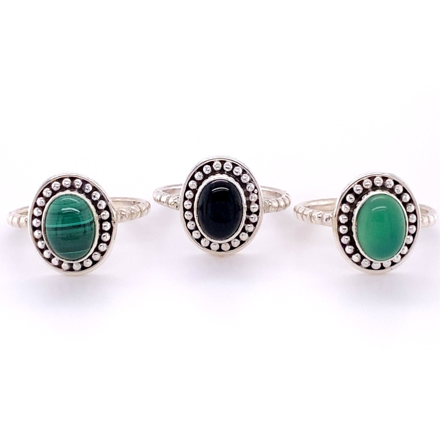 Three Oval Gemstone Rings with Silver Ball Border.