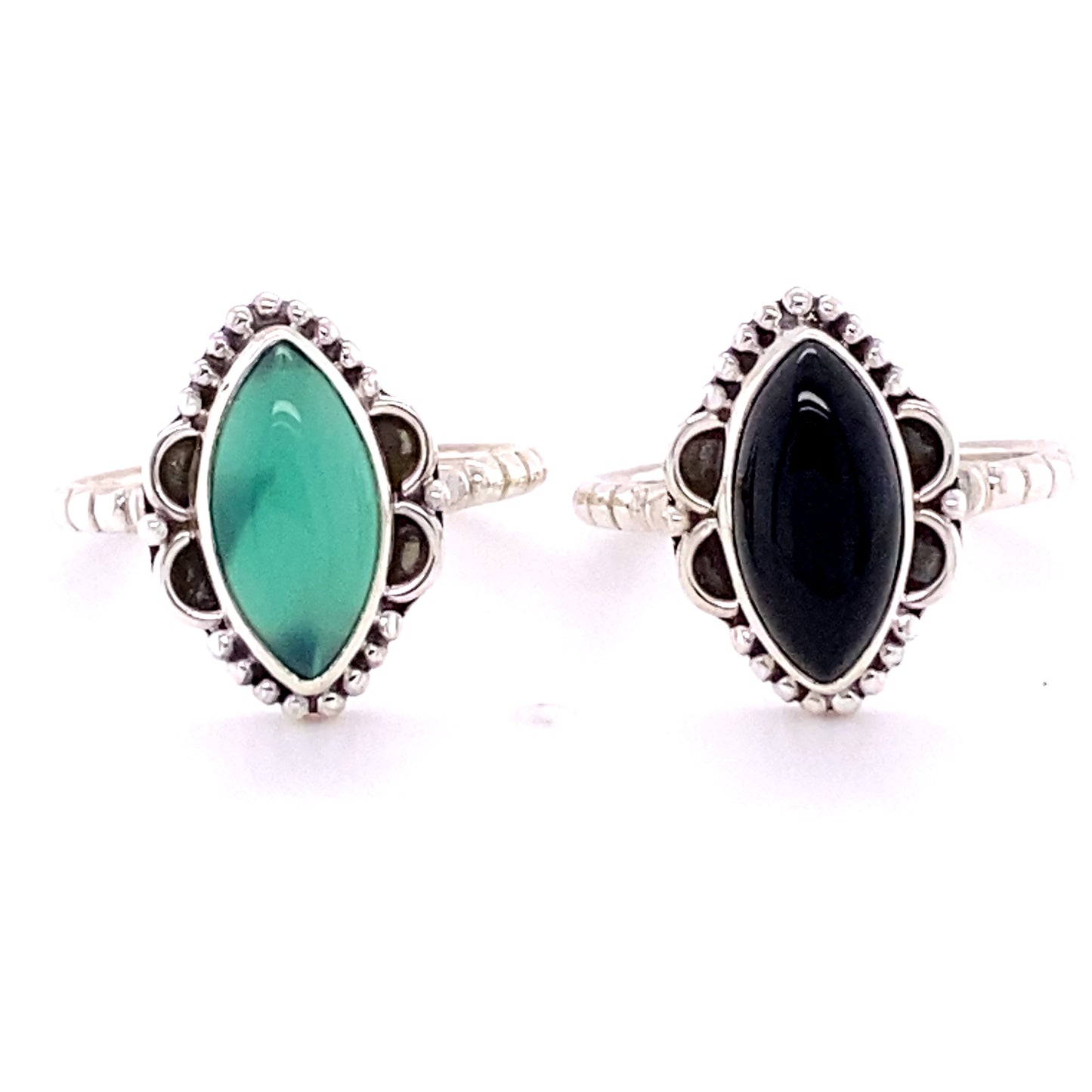 
                  
                    Two Marquise Shaped Gemstone Rings with Ball Border and Textured Band, with black and green cabochon stones.
                  
                